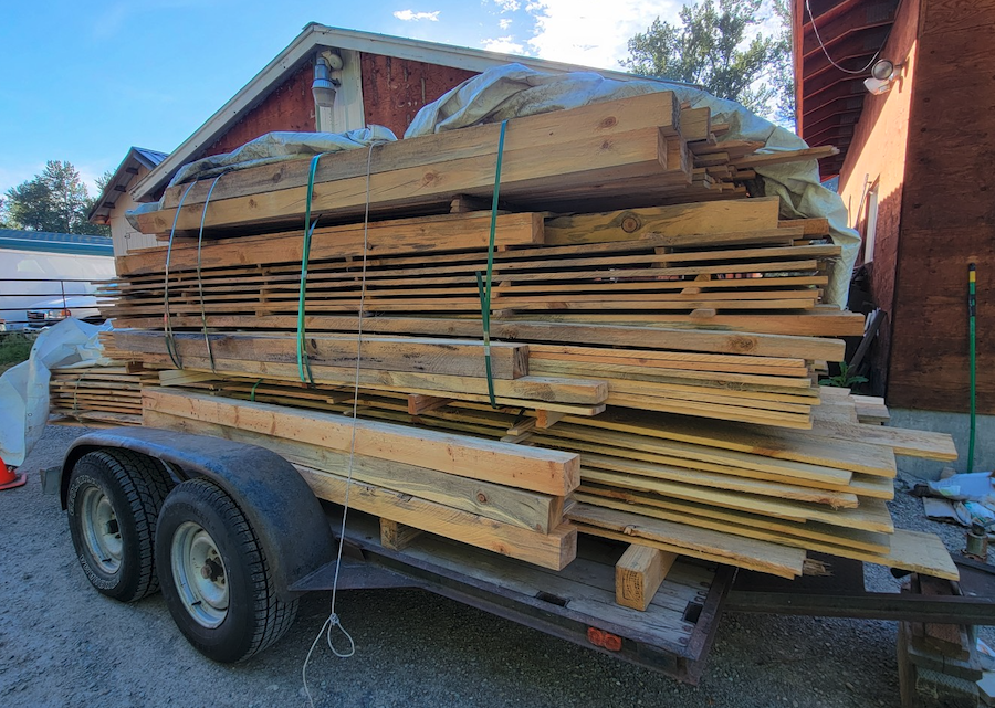 Cody's trailer filled to overflowing with blue pine he put through his Woodmaster